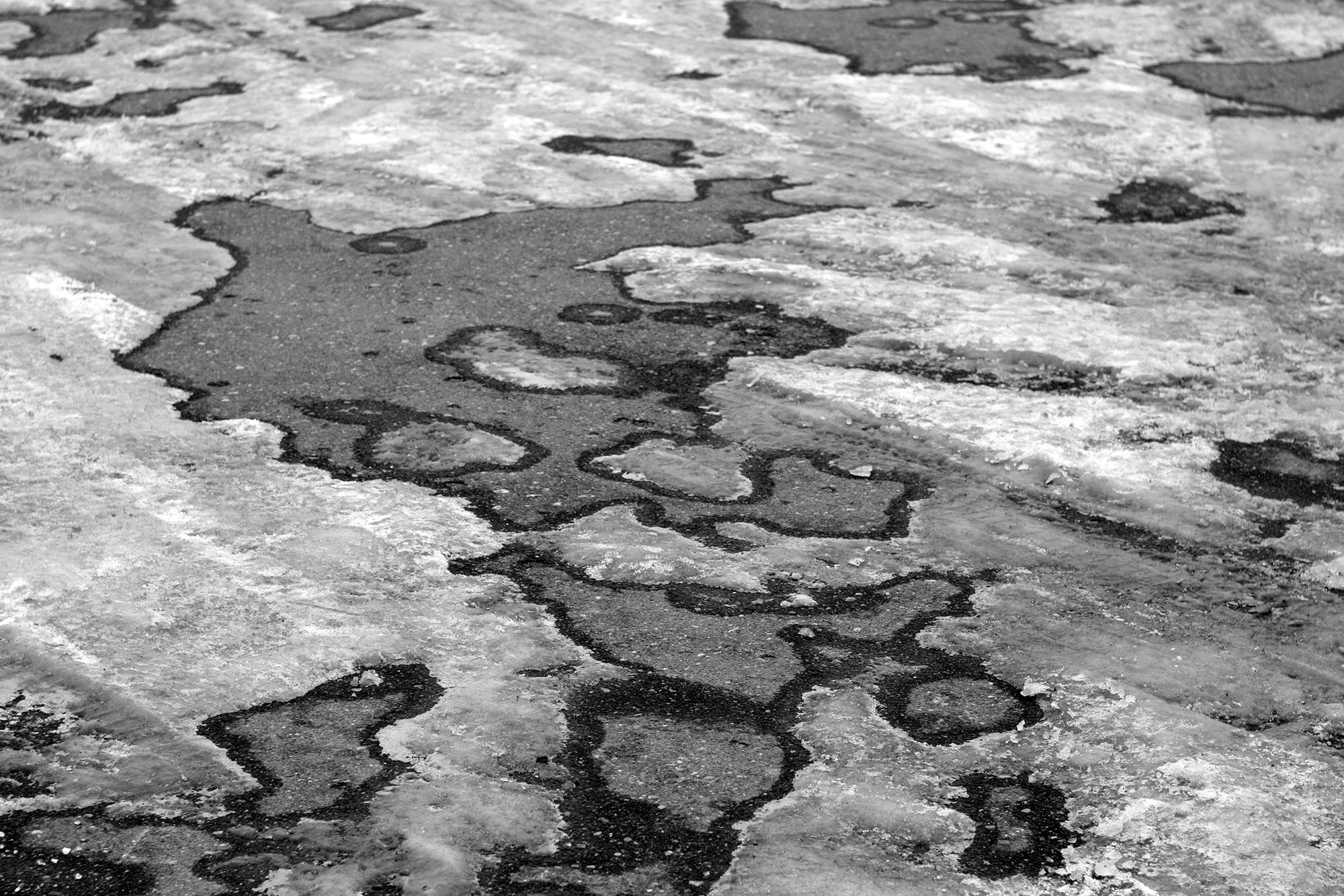 Ice-covered blacktop.