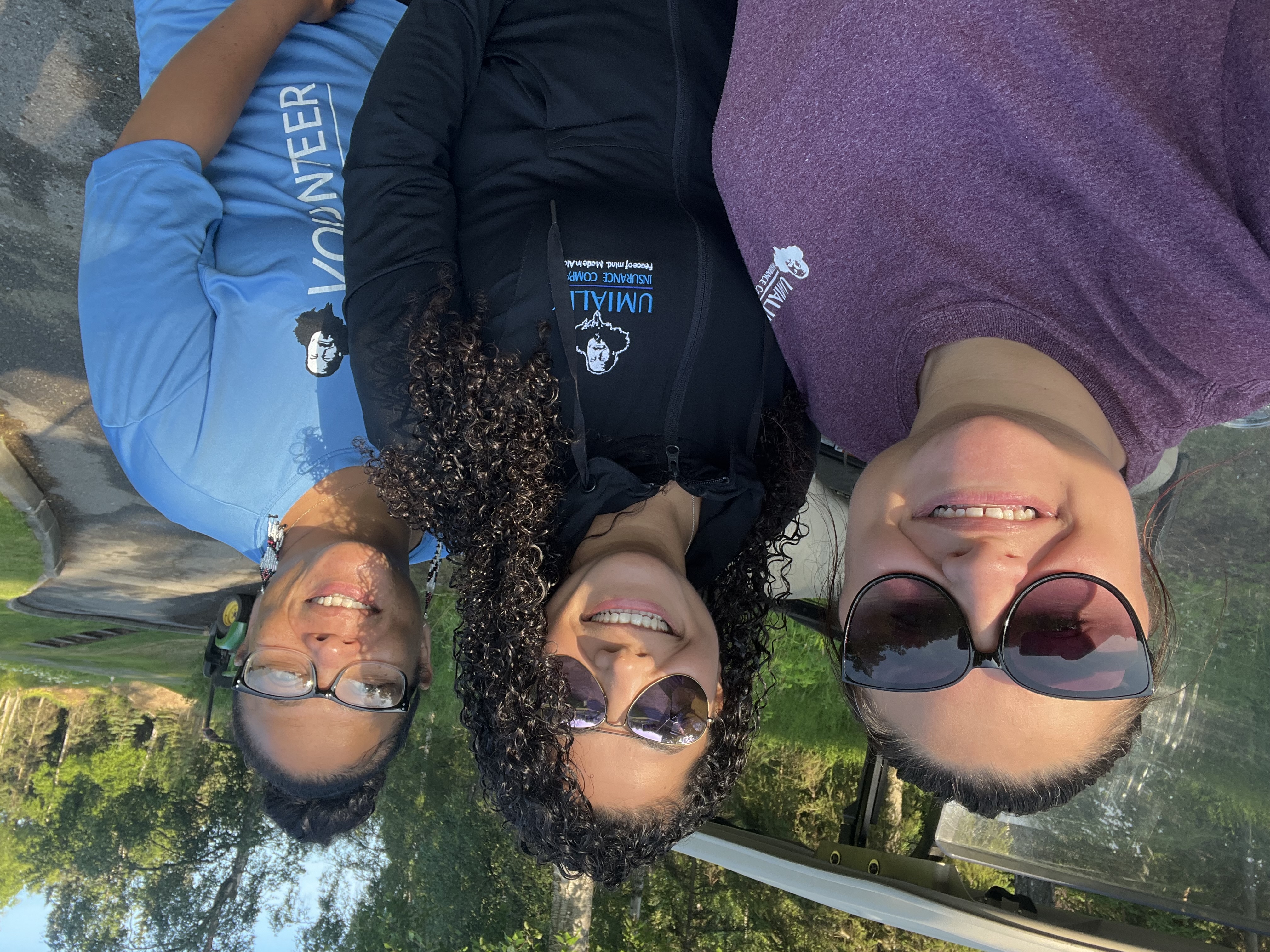 The Umialik employees posed together outdoors for a selfie.